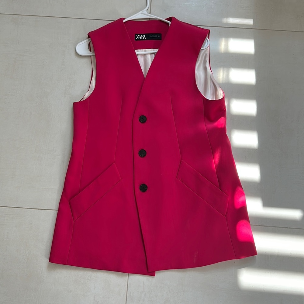 Pink/Red button up work vest.
